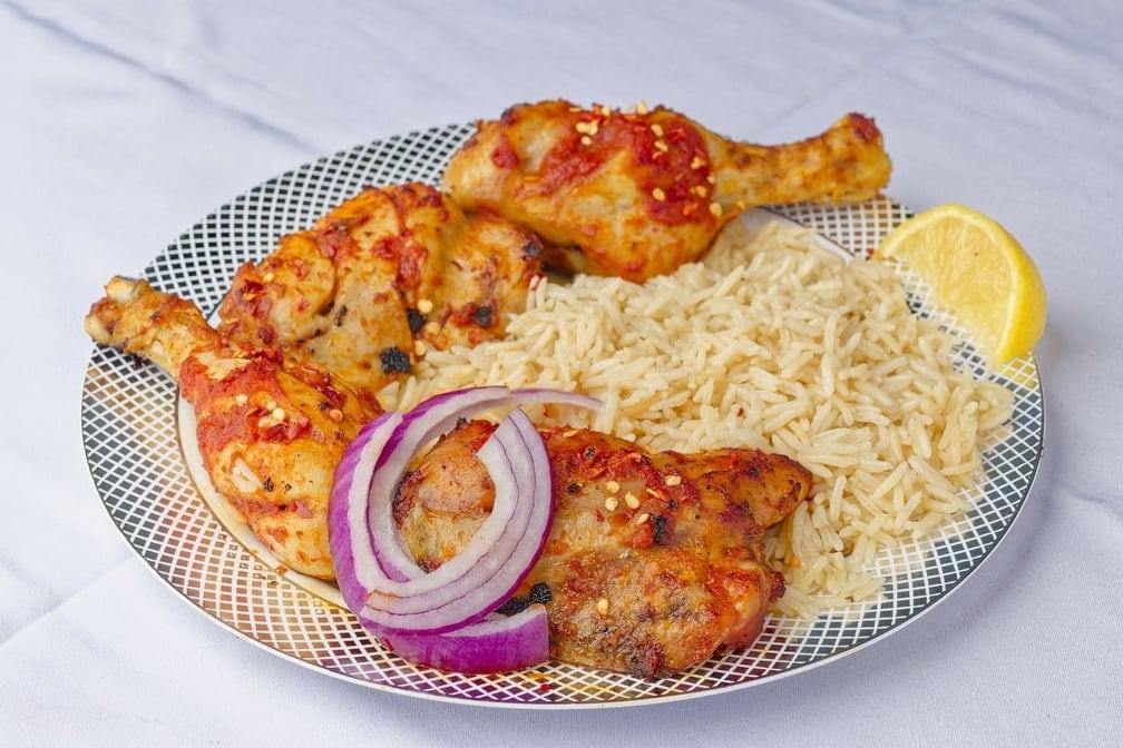 Low carb romance 4 tandoorie chicken legs with rice.