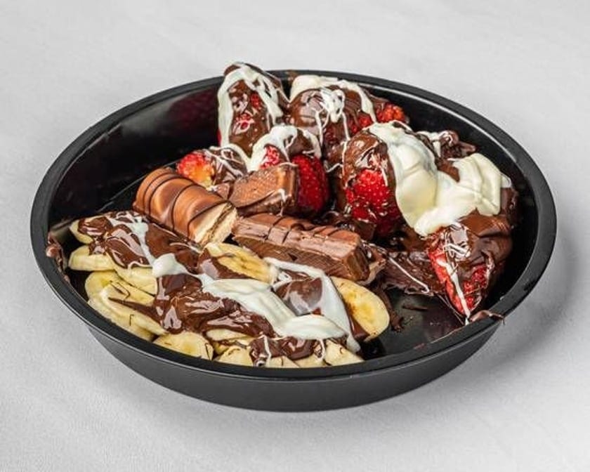 Chocolate ganache with bananas and strawberrys.